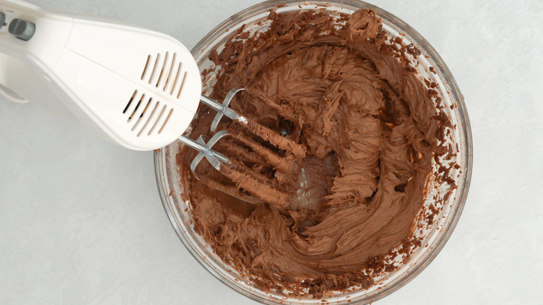 mixing chocolate buttercream frosting bowl