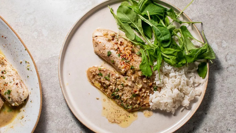 Chicken breasts with rice and greens