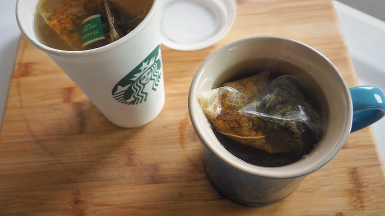 Tea bag in a steaming cup of tea