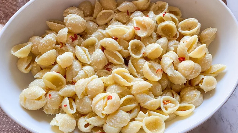 Bowl of pasta shells with chili flakes