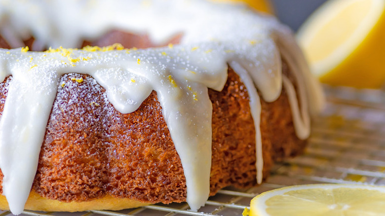 Round lemon cake with icing drizzle