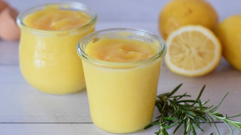 Small glass jars of thick lemon curd