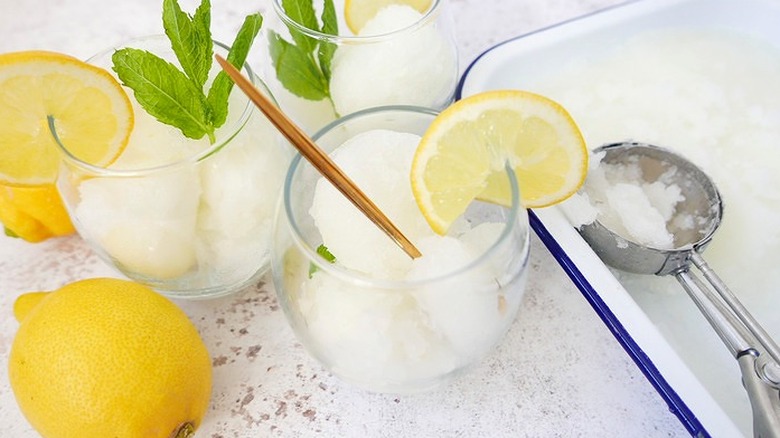 Glass dishes of Italian ice with lemon slices