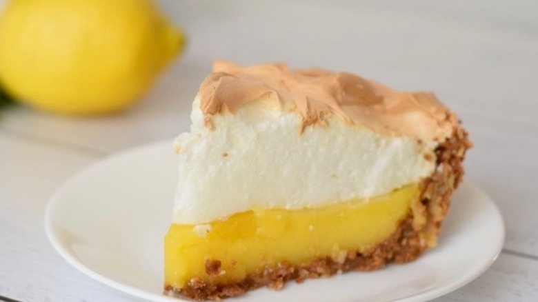 Slice of lemon pie with thick meringue topping