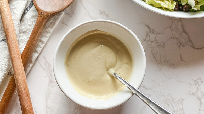 Creamy tan tahini sauce in bowl