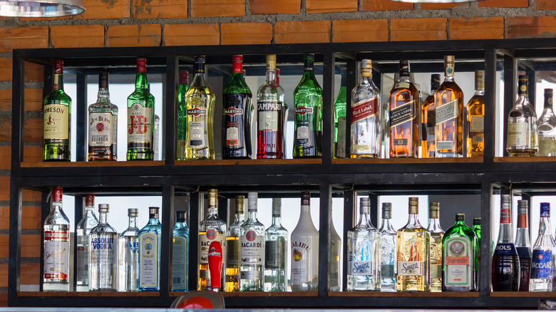 liquor bottles on bar shelf