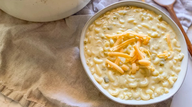 Bowl of elbow pasta in thick cheese sauce. 