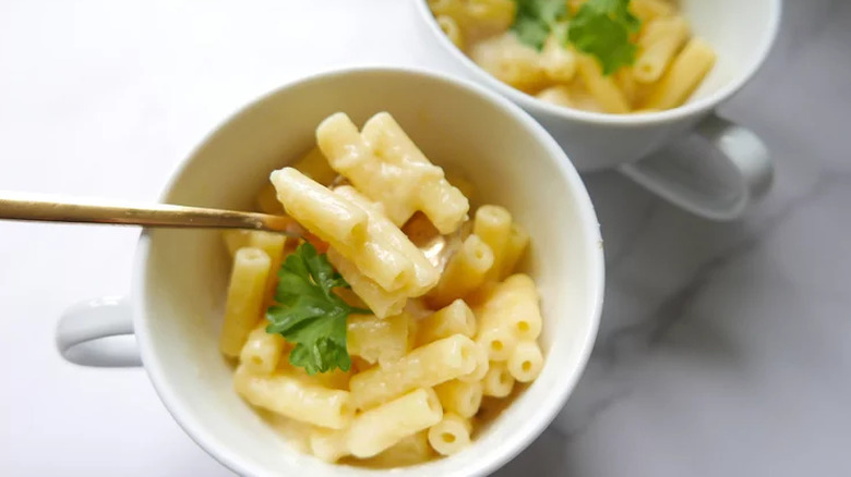 Teacups filled with mac and cheese