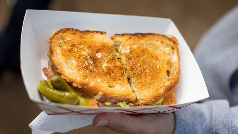 Crispy Melty grilled cheese on paper tray