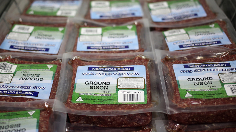 Ground bison packages arranged at store