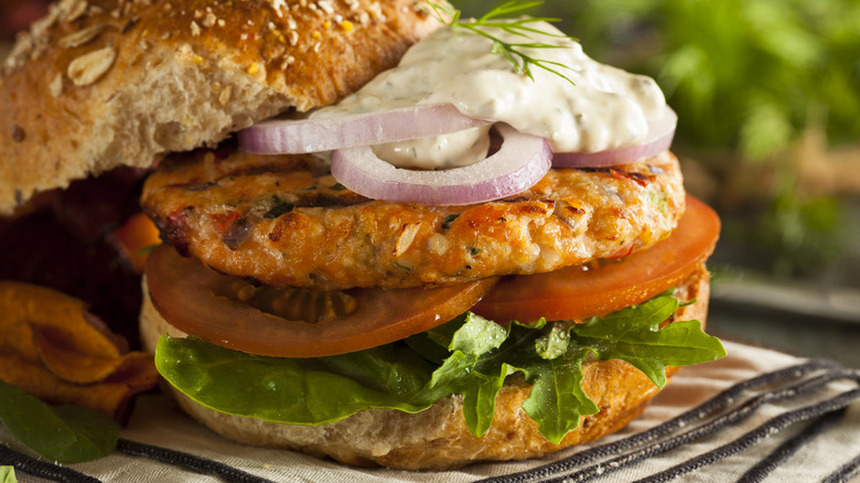 Salmon burger topped with tartar sauce