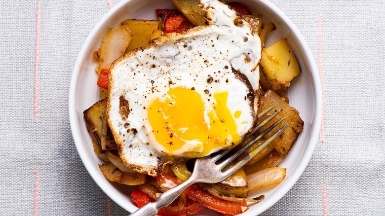 fried egg on mixed vegetables