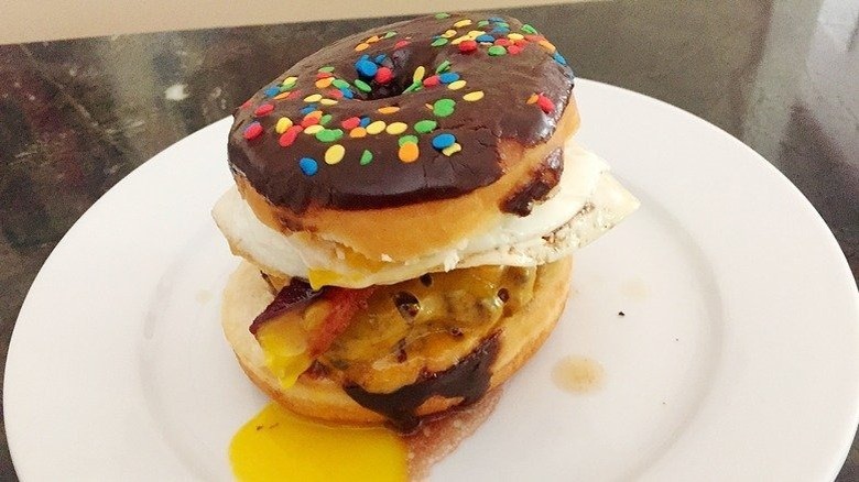 bacon egg cheeseburger on donut