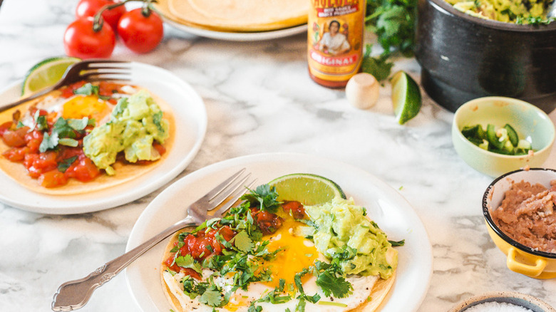 huevos rancheros with lime wedges