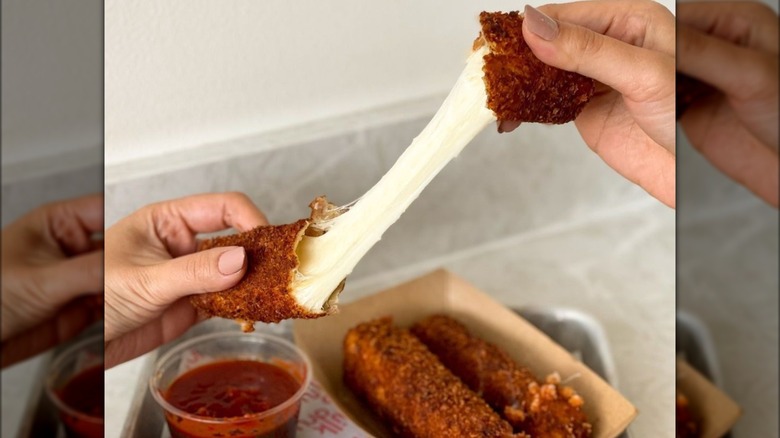 Milk Drunk mozzarella sticks cheese stretch