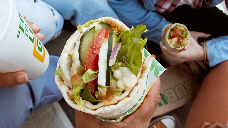 Person holding Subway Lavash Wrap