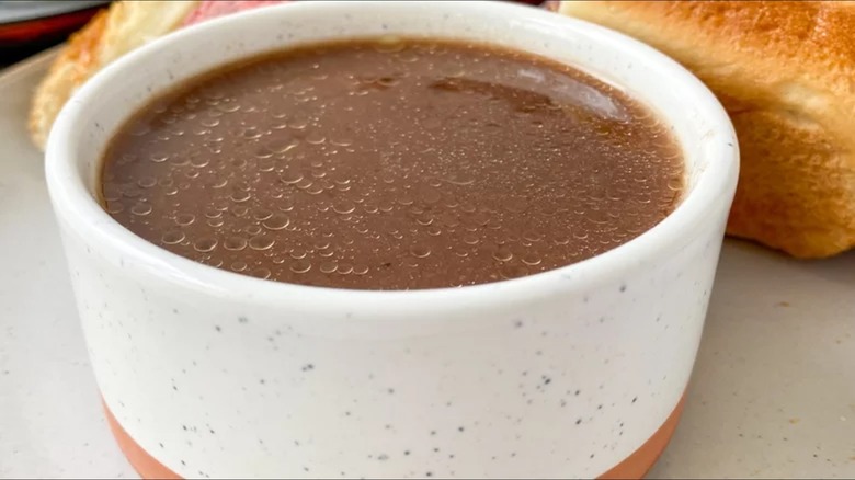 Au jus in ceramic bowl with bread