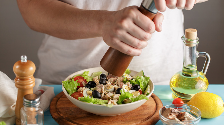 Man using a pepper mill