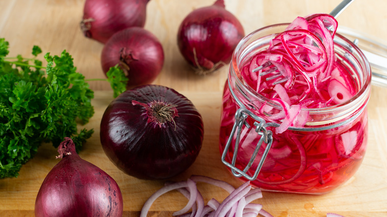 jar of pickled red onions and whole onions