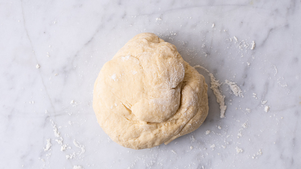 dough being formed for pierogies