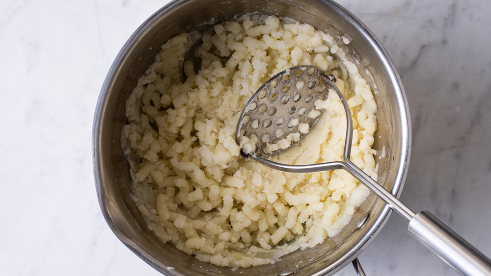 person filling pierogies