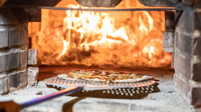 pizza in a wood fired brick oven
