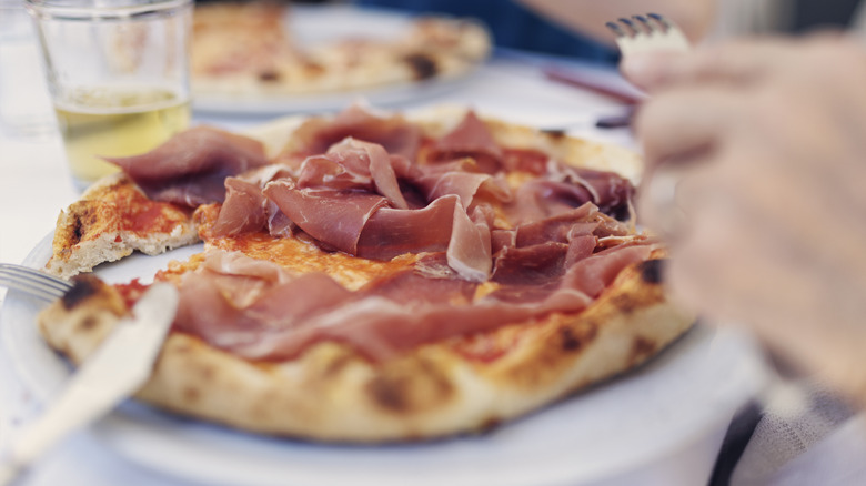 pizza topped with prosciutto