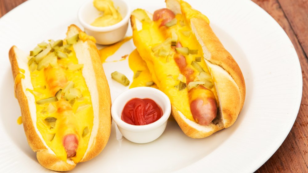 hot dog with cheese sauce