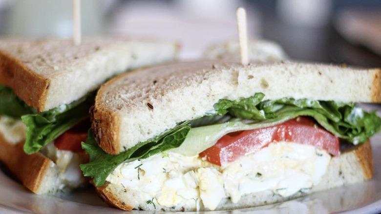 Egg salad sandwich with lettuce and tomato