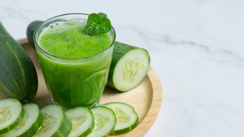 hydrating cucumber juice on wood board