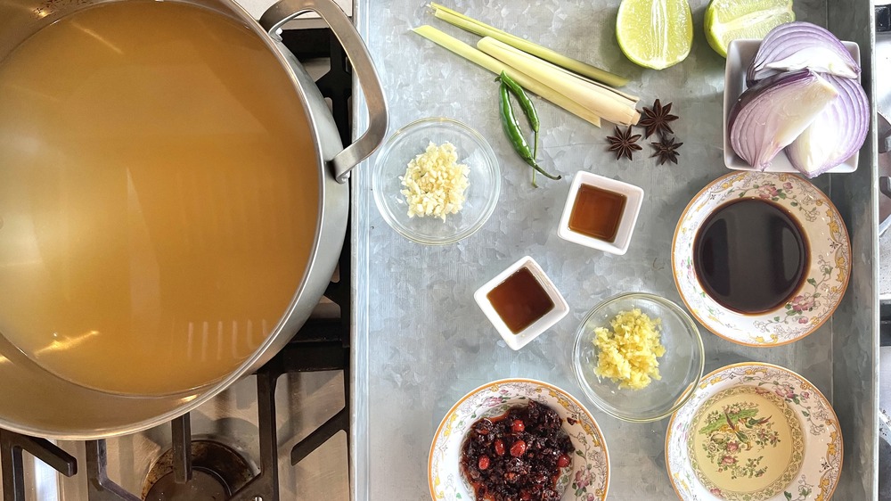 preparing the broth for ramen