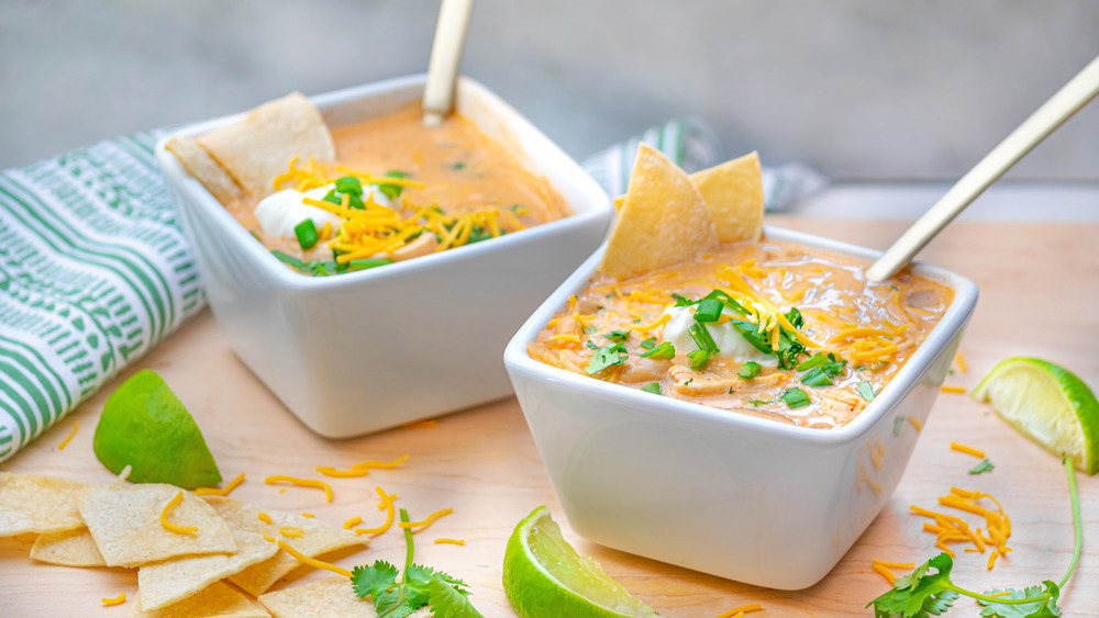 White chicken chili with chips and lime