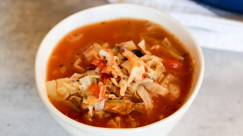 Bowl of cabbage soup with red broth