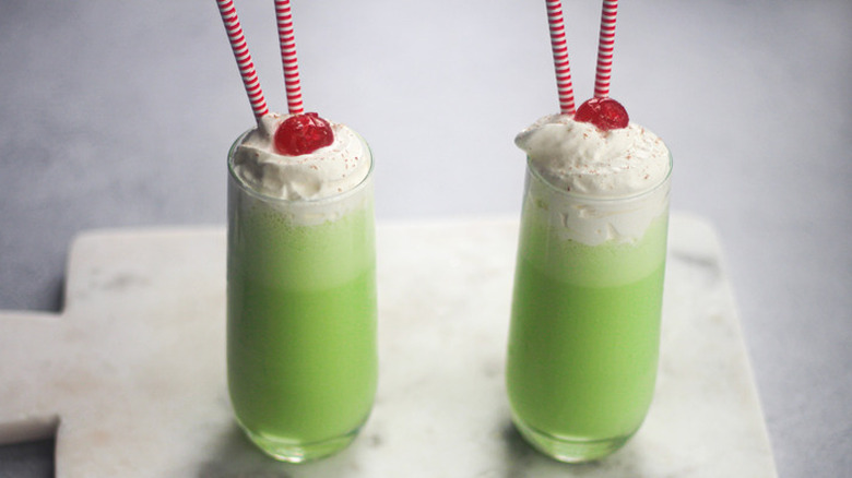 Two glasses with green milkshakes