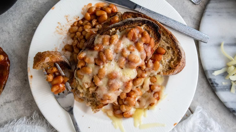 Canned beans and melted cheese over thick toast.