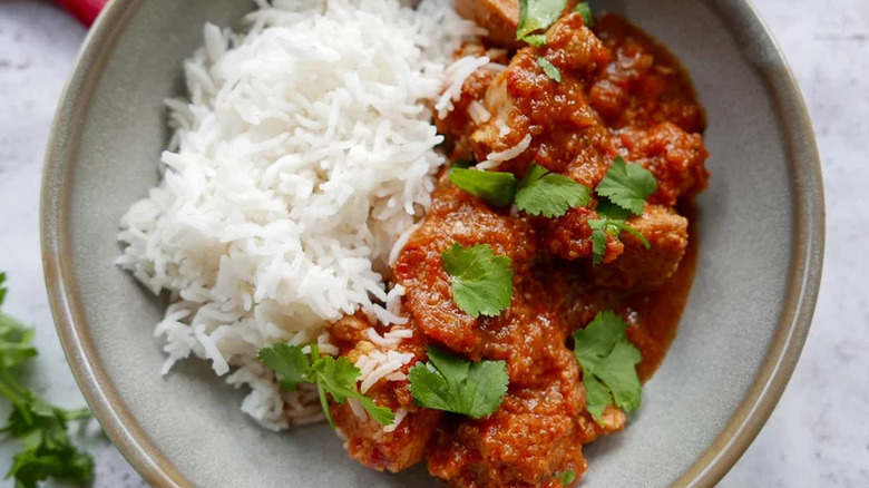 Rice with chicken in red sauce