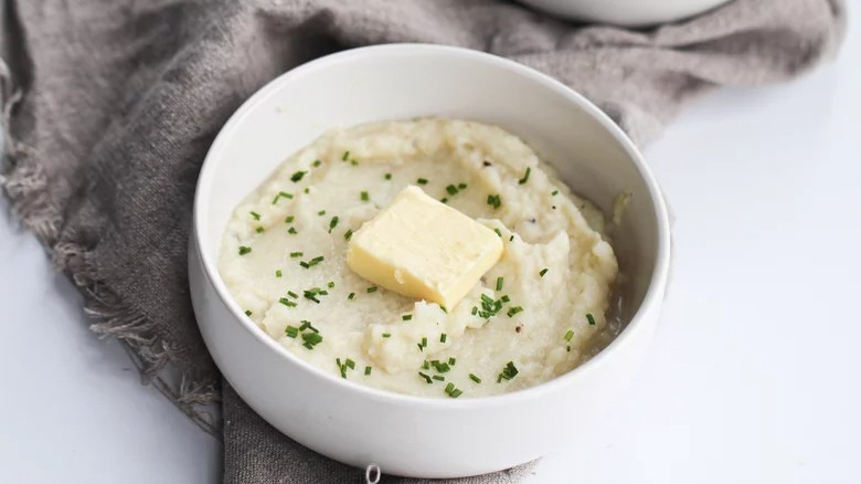 bowl of instant pot mashed cauliflower with butter
