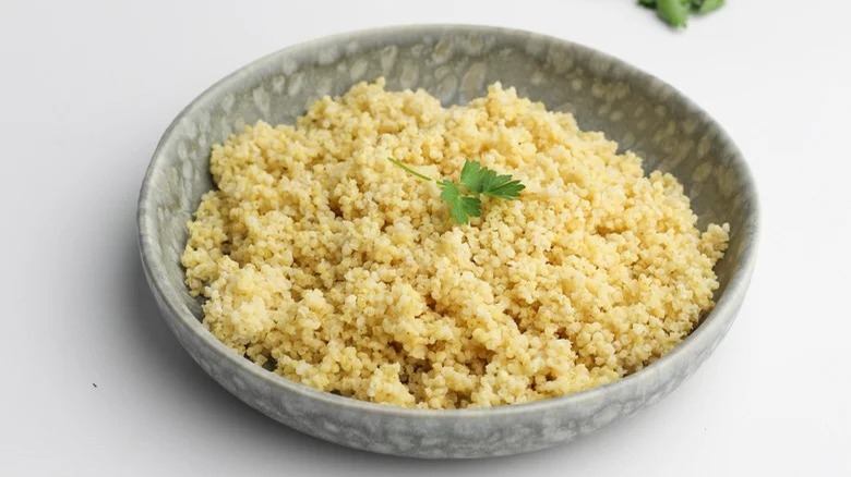 bowl of instant pot millet with garnish