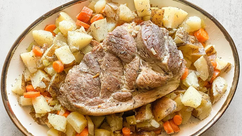 Cooked pork with carrots and potatoes