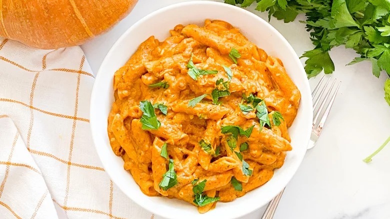 bowl of instant pot pumpkin pasta with fork
