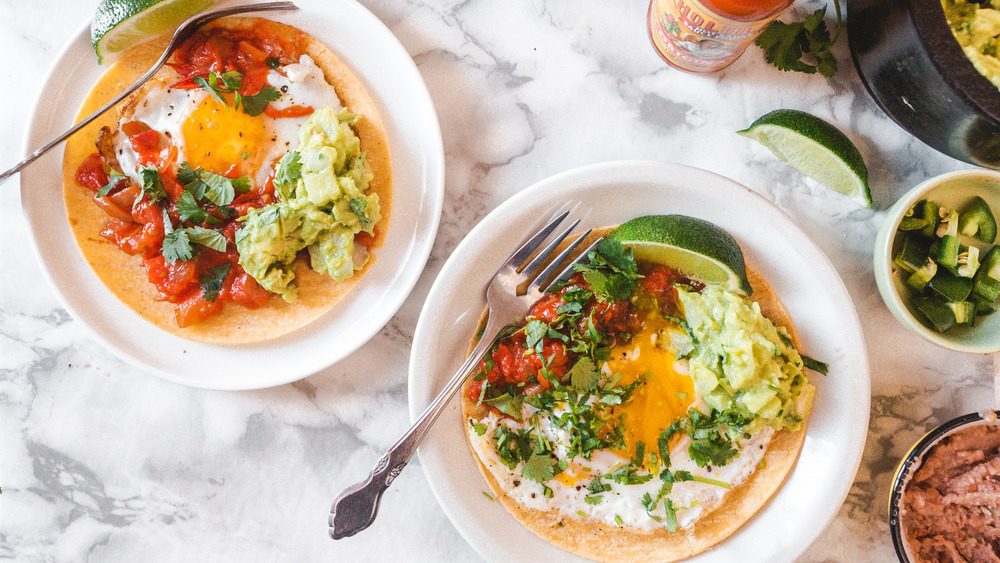 Huevos rancheros with lime and avocado