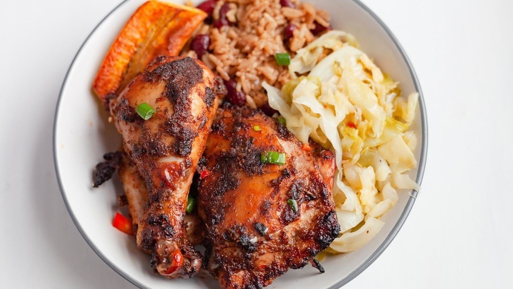 spicy jerk chicken with cabbage, red beans and rice, and plantain