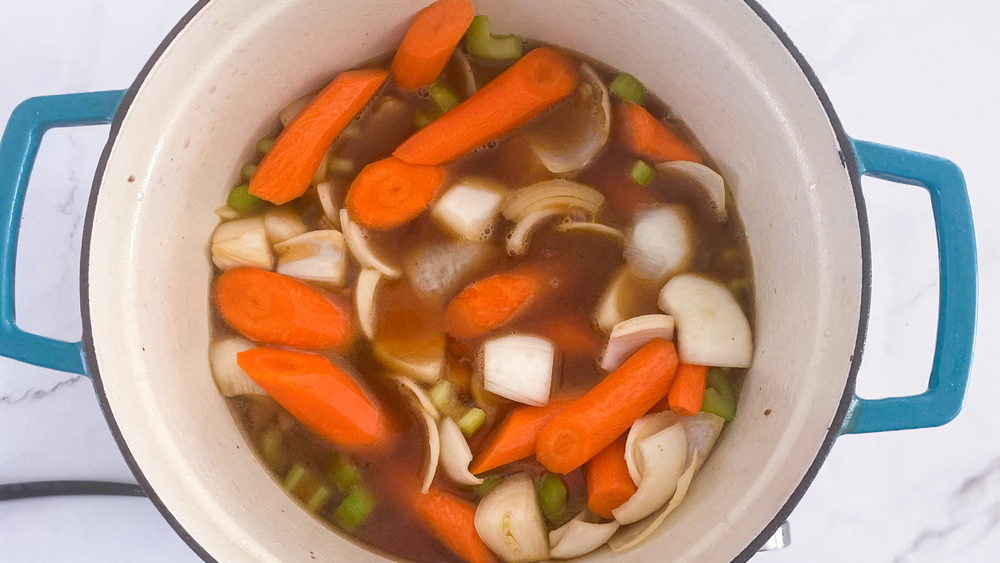 vegetables and stock in dutch oven