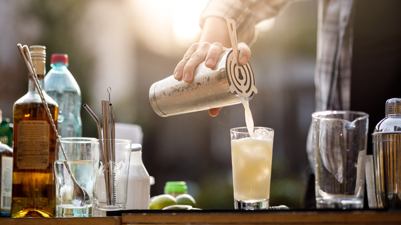 bartender preparing a piña colada