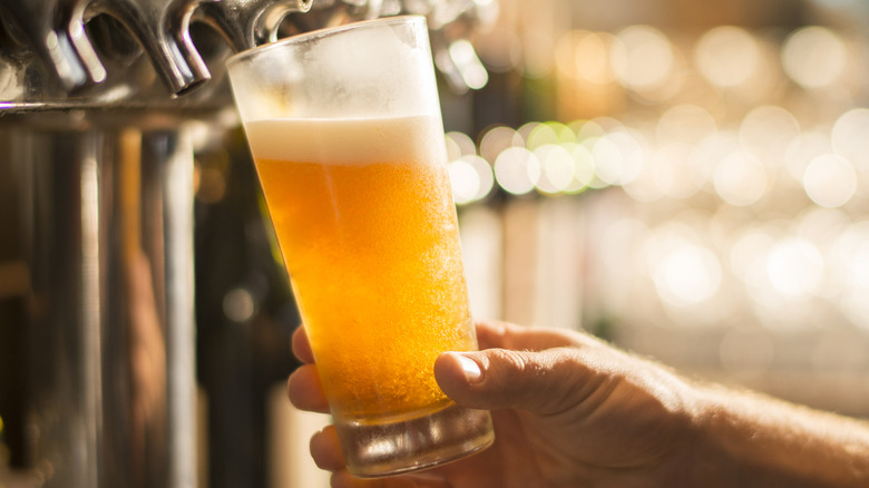 Pouring beer into a pint glass