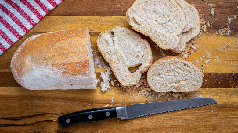 Serrated knife on cutting board