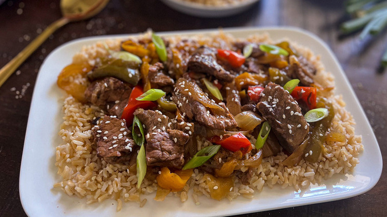 Strips of beef, peppers, and onion over rice. 