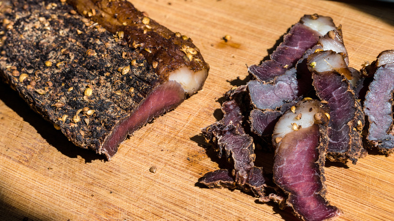 slab of biltong with slices on board