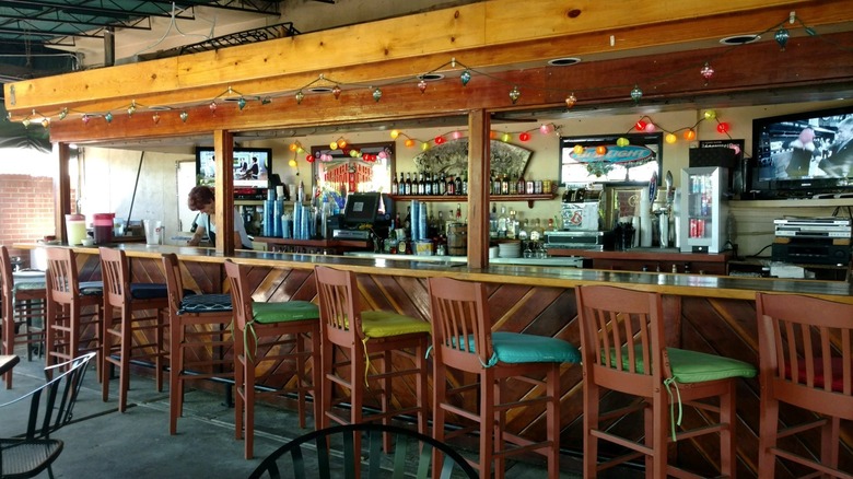 Wooden bar counter decorated with twinkle lights