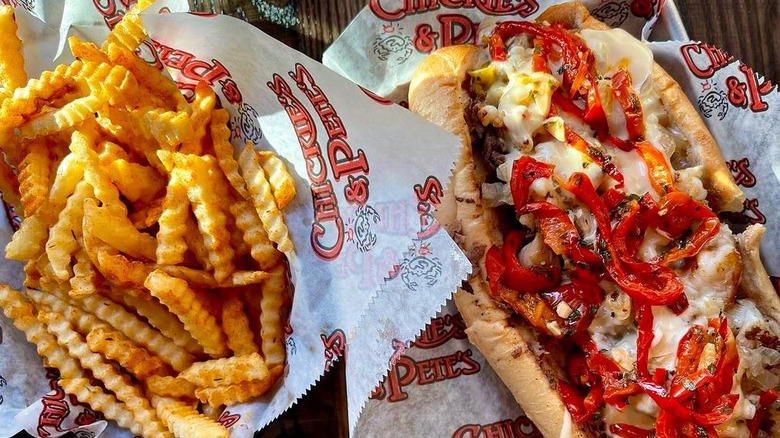 Hot dog and a basket of French fries. 